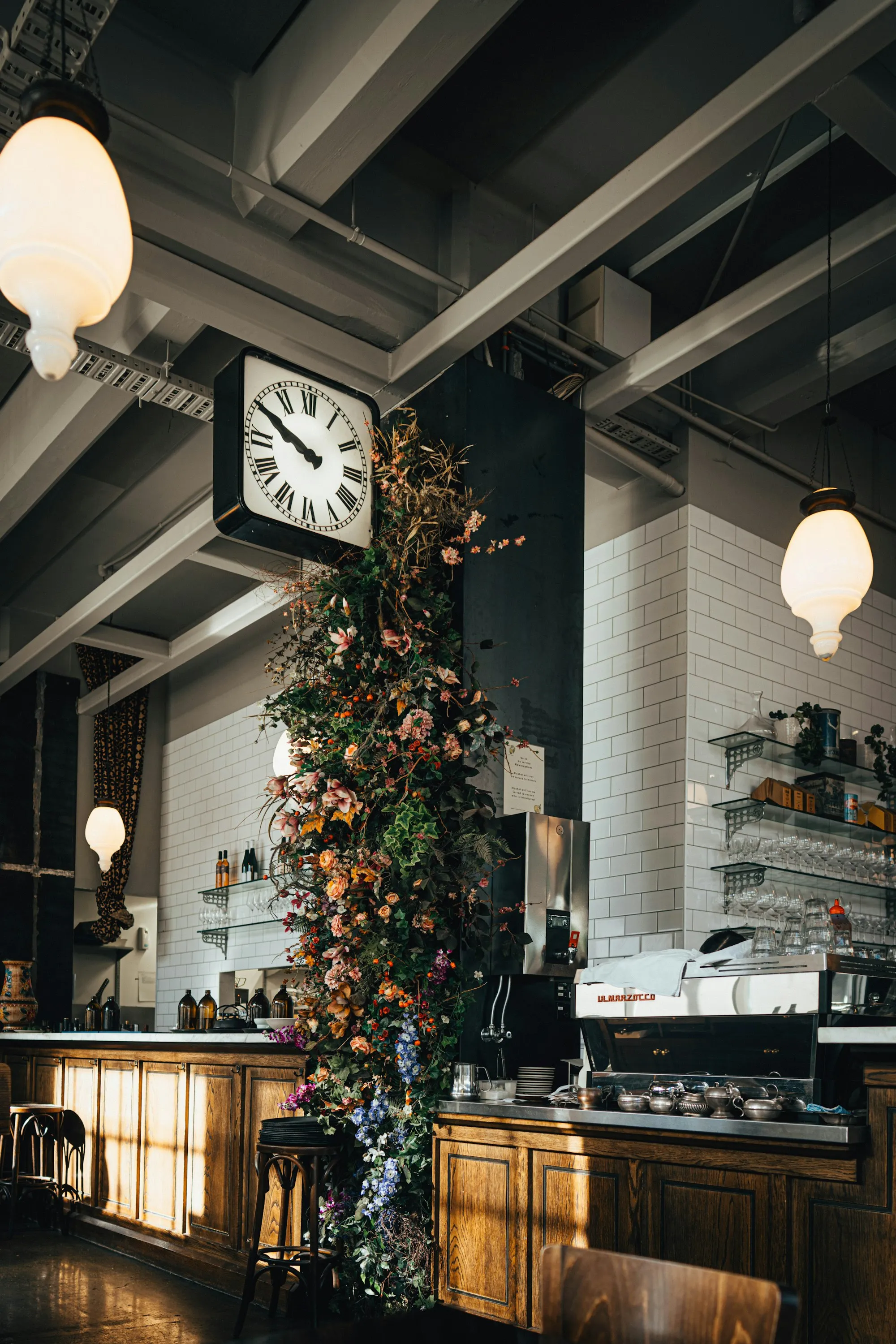 A large clock on the wall of a Wellington café